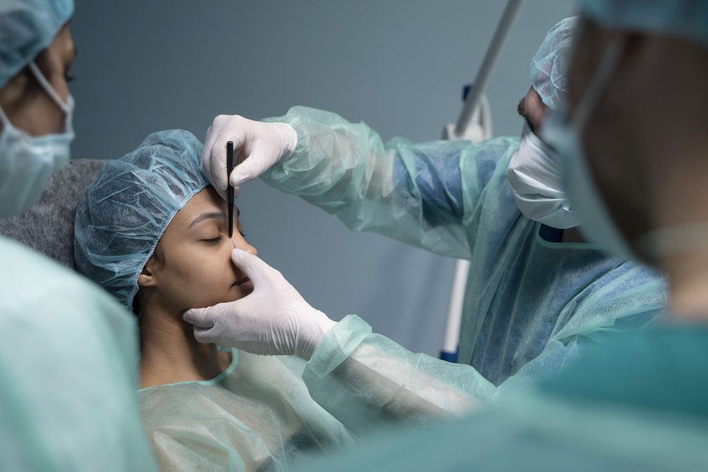 Surgeon performing skin graft surgery at Regain Aesthetic Clinic Kolkata